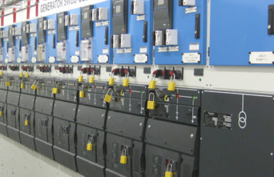 a row of electrical generator switches